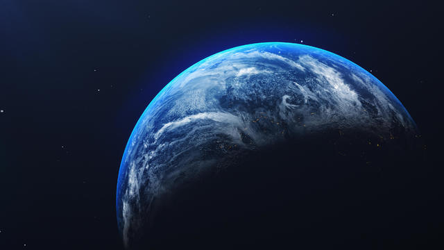 Close-Up Of Earth Against Blue Sky At Night 