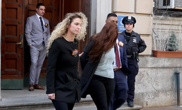 NYPD 10th Precinct detectives walk Lauren Pazienza to face manslaughter charges for the shoving of 87-year-old Lauren Maker Gustern. 