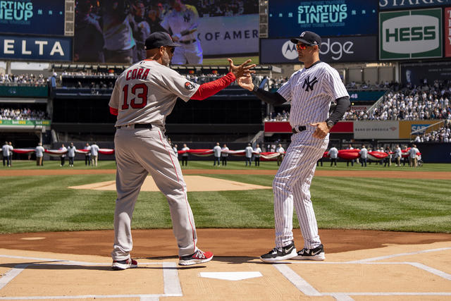 Bronx, USA. 08th Apr, 2022. New York Yankee manager Aaron Boone on the  dugout steps before his team plays the Boston Red Sox on opening day at  Yankee Stadium on Friday, April