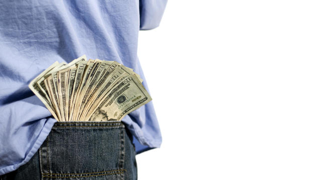 man with money in his back pocket 