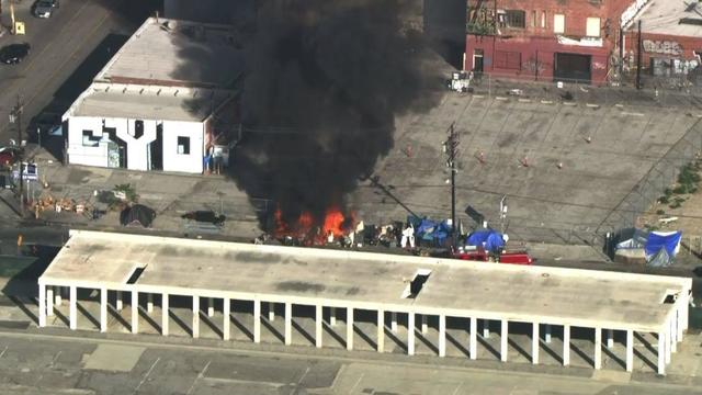 Fire erupts at downtown LA homeless encampment 