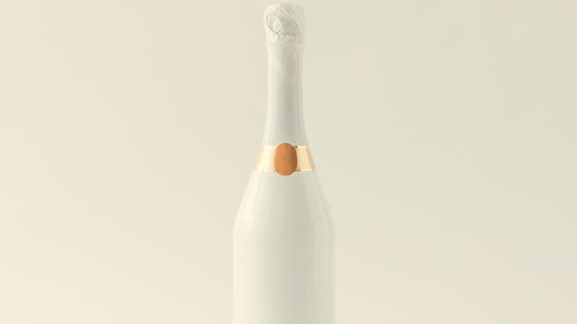 Minimalistic white champagne bottle on white background. Party concept. 