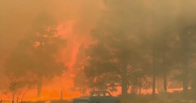 Wildfires rage in the West as storms also bring blizzard conditions and ...