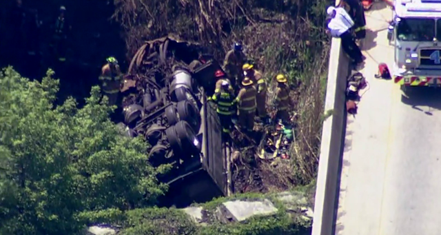Dump truck crashes between bridges in Edgewater