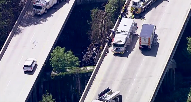 Dump truck crashes between bridges in Edgewater