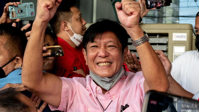Philippine presidential candidate Ferdinand "Bongbong" Marcos Jr., son of late dictator Ferdinand Marcos, greets his supporters at his headquarters in Mandaluyong City 
