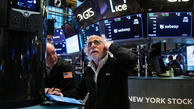 Trader with hand on head at the New York Stock Exchange 