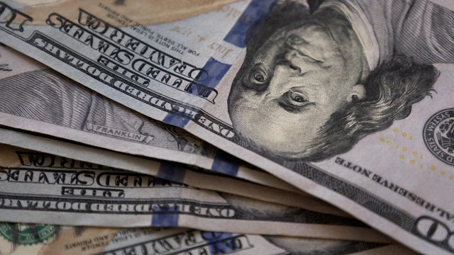 full frame of spread of crisp $100 bills 