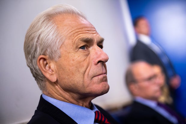 Peter Navarro listens as President Donald Trump speaks during a news conference at the White House on Friday, Aug. 14, 2020.