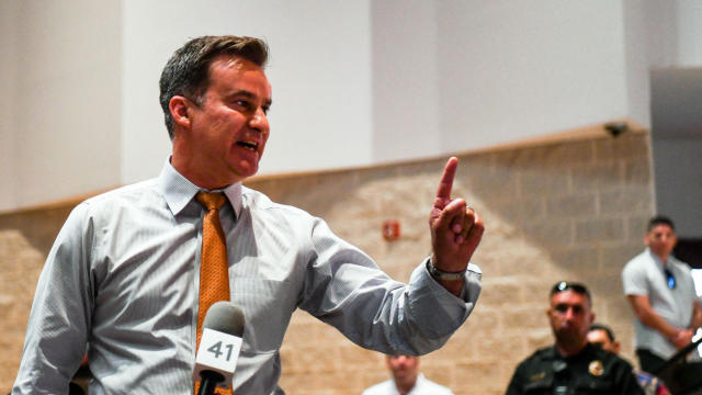 Democratic Texas state Senator Roland Gutierrez interrupts a press conference held by Texas Governor Greg Abbott in Uvalde, Texas, on May 27, 2022. 