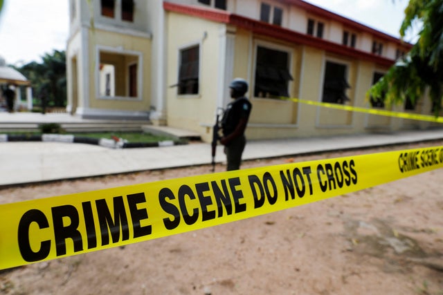 A police crime scene tape is seen in front of St. Francis Catholic Church where gunmen attacked worshippers during a Sunday mass service in Owo 