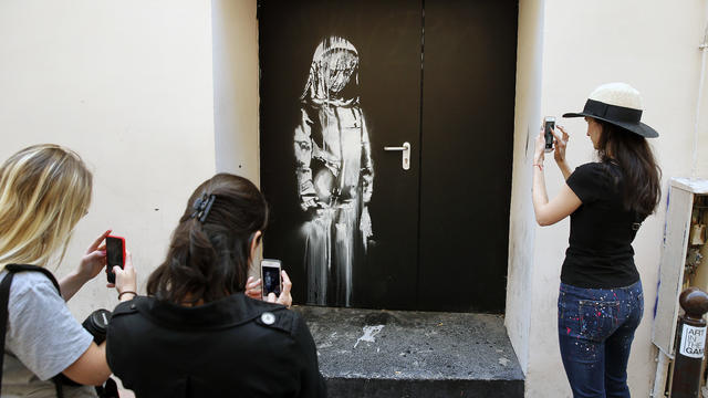 Graffiti Artist Banksy Mural In Paris 