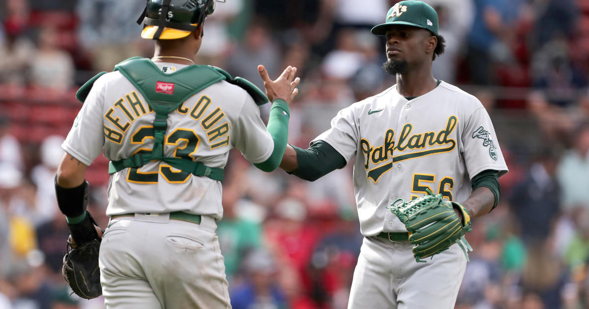 Streaking A's sweep past plummeting Sox