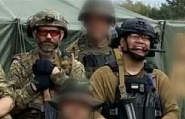 American military veterans Alexander Drueke, left and Andy Tai Ngoc Huynh are seen with other foreign fighters in Ukraine.