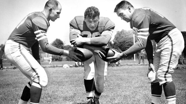 San Francisco 49ers Y.A. Tittle, Hugh McElhenny, and Frankie Albert Photo ran 08/22/1952, p. 1; Photo shot  07/22/1952 