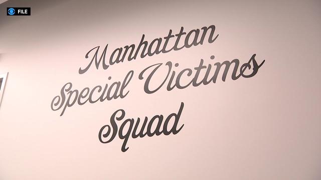 The words "Manhattan Special Victims Squad" in cursive on a wall 