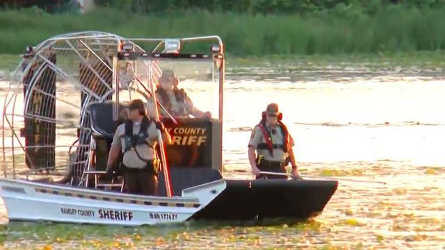Mother drowned 3 children and herself in lake after her husband fatally shot himself, police say