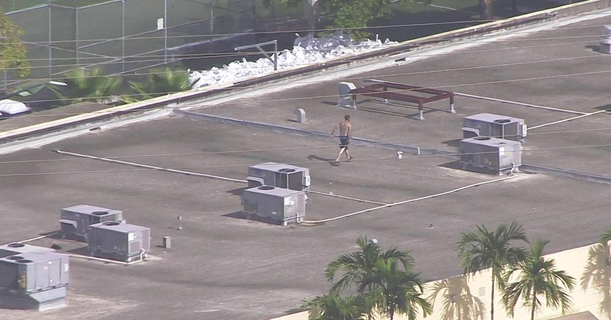 Armed man on roof of Doral building wanted by police for driving stolen car