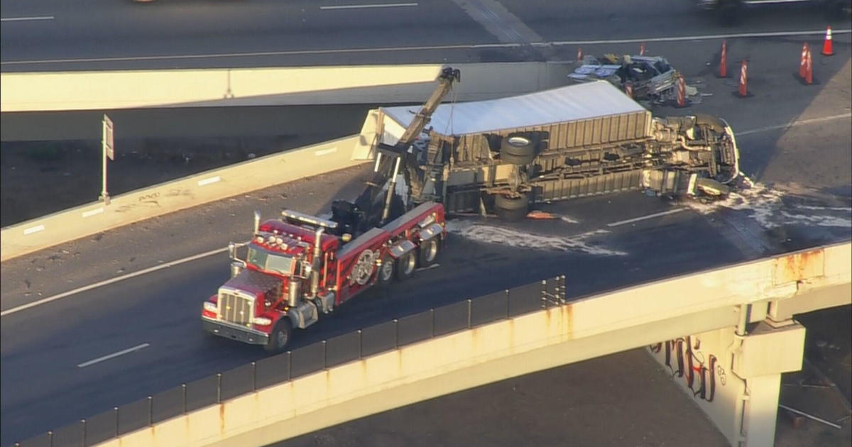 1 Dead After Semi-truck Flips On 6th Ave At I-25 In Denver - CBS Colorado