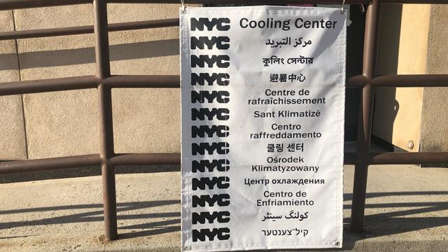 NYC Cooling Center sign in multiple languages, New York State Department of Health, air conditioned facilities where people can get relief during extreme heat, Queens, New York 