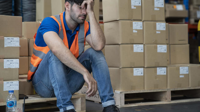 Depressed worker feel tried after overwork and disappointed for his job or being fired. 