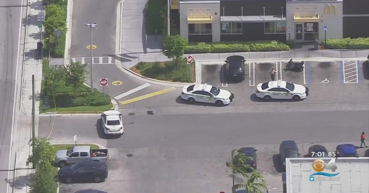 Woman struck after shooting between 2 cars in NW Miami-Dade - CBS Miami