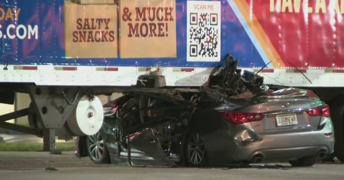 Car wedged under 18-wheeler in NW Dade crash