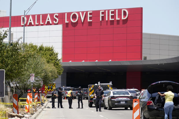 Emergency responders converge near the main entrance at Dallas Love Field airport in Dallas, July 25, 2022. 