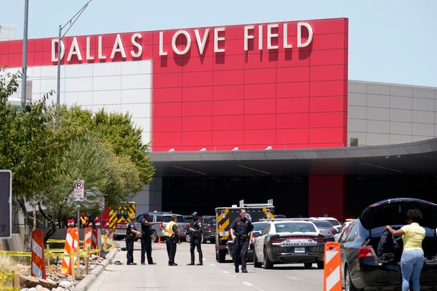 Emergency responders converge near the main entrance at Dallas Love Field airport in Dallas, July 25, 2022. 