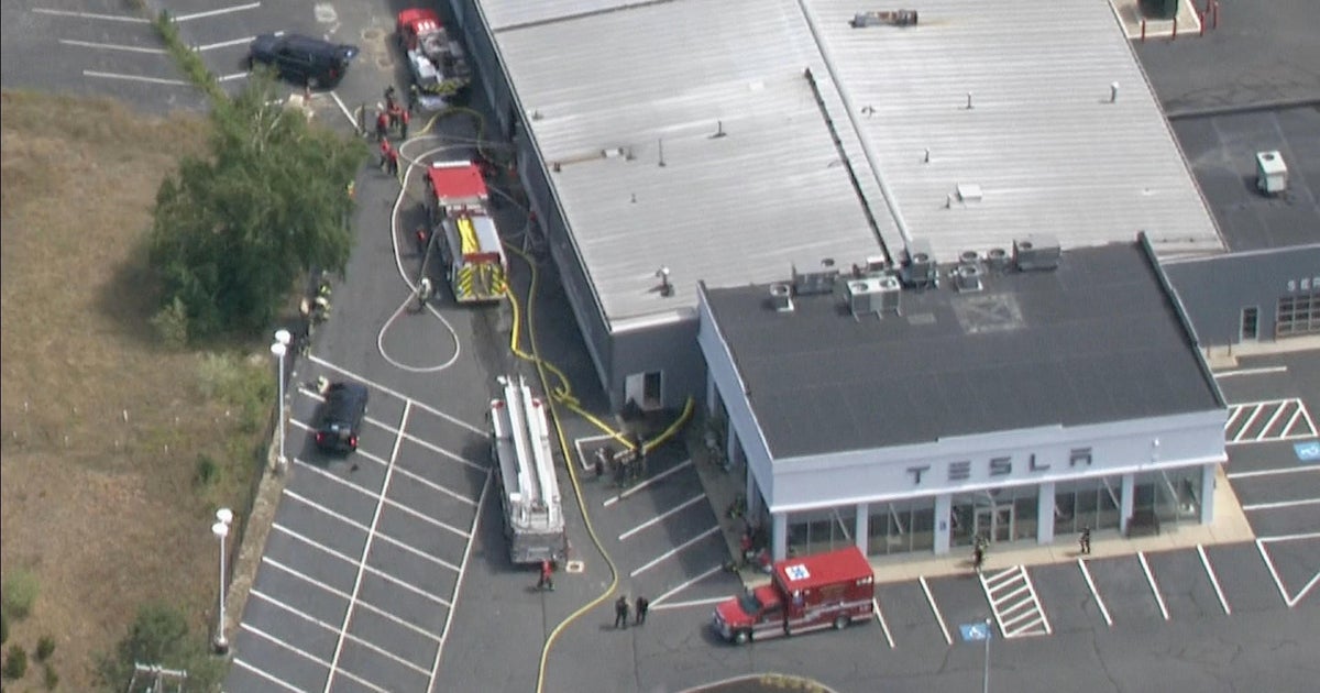 Malfunctioning battery sparks fire at Tesla dealership in Norwell CBS