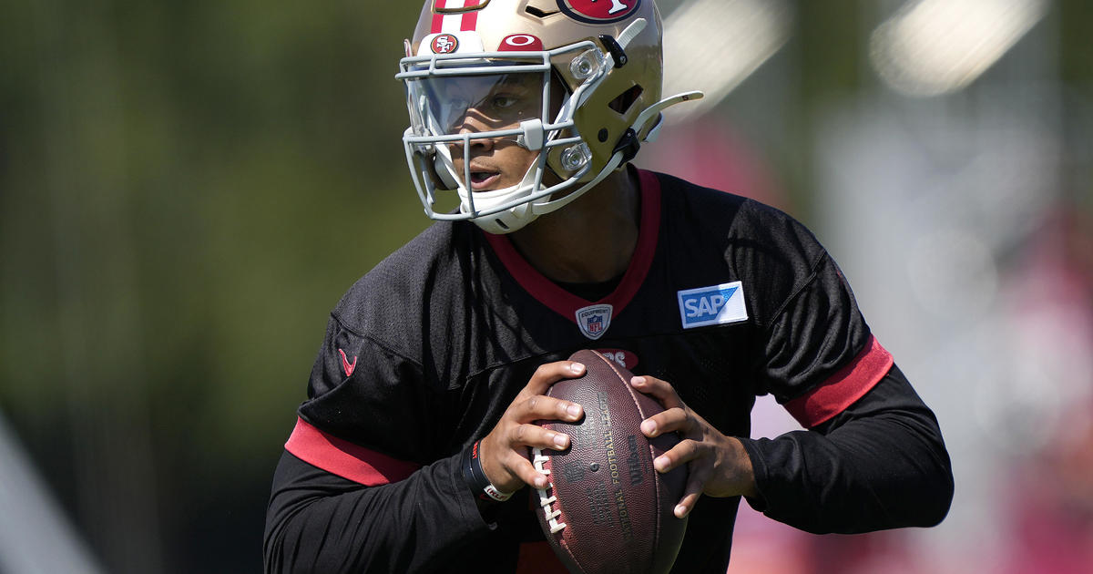 Quarterback Trey Lance of the San Francisco 49ers scrambles