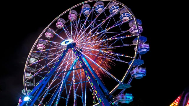Illuminated Ferris wheel with neon lights at the Ventura County Fair 