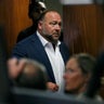 Alex Jones walks into the courtroom 