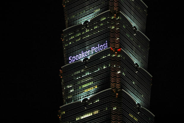 The Taipei 101 building lit up with a message reading 