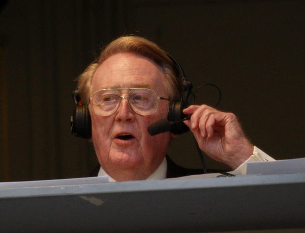 Dodgers sportscaster Vin Scully works the game during the Dodgers– Angels exhibition game at Dodger 