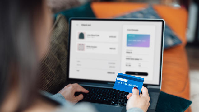 Woman using credit card for online shopping 