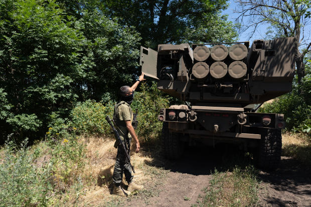 A Ukrainian commander shows the rockets on a HIMARS vehicle in eastern Ukraine on July 1, 2022. 
