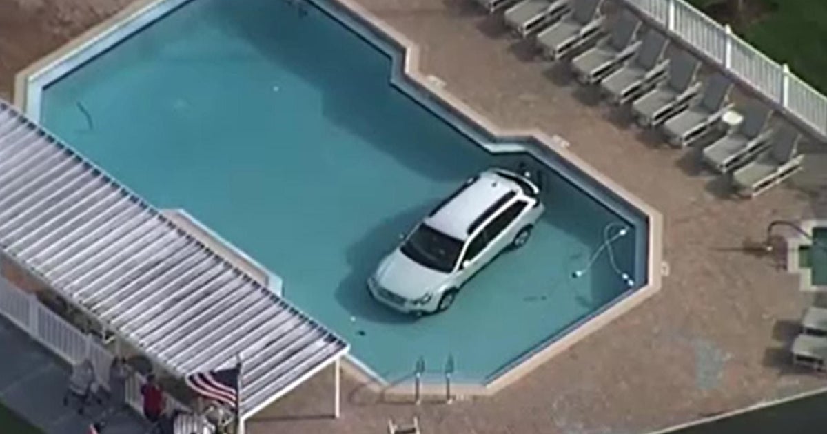 Car crashed into Florida pool, driver pulled to safety
