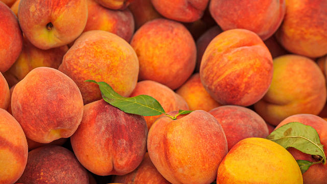 Fresh peaches on display at the Mercato di Rialto along the Grand Canal in Venice, Italy 
