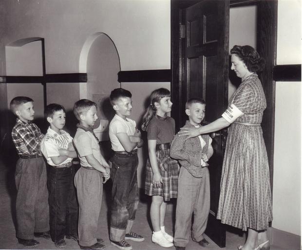Schoolchildren wait for polio vaccine in 1950s 