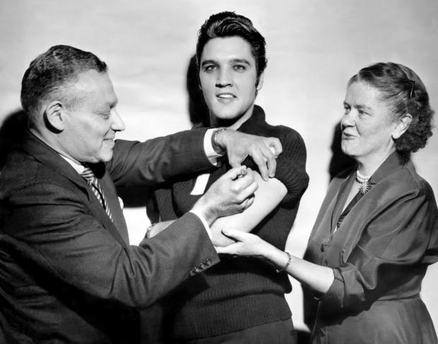 Elvis Presley receiving a polio vaccination 