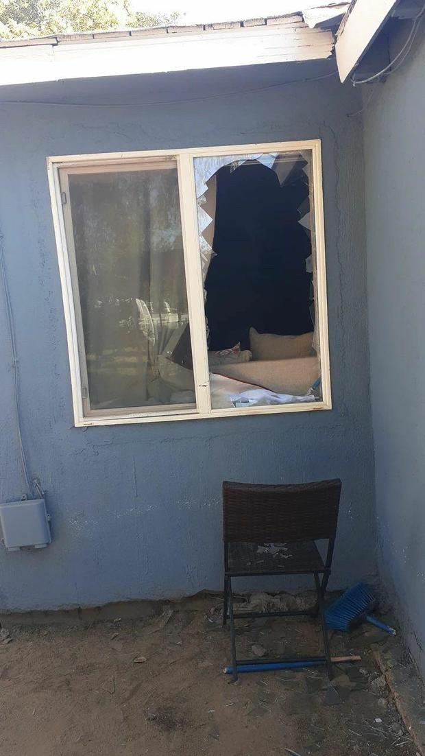 Photo of a broken window at a home in Modesto 