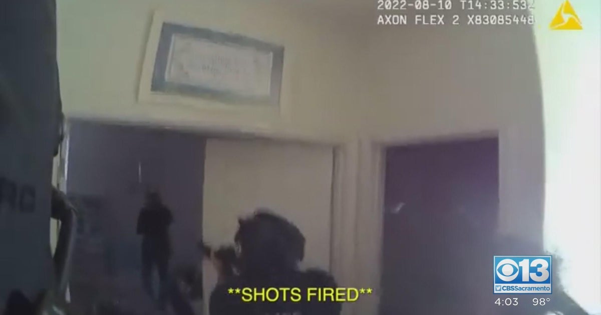 Body cam video released of officer shooting man armed with sword during hostage situation