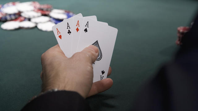 Man with four aces in casino 