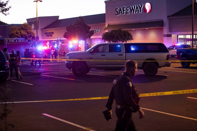 Emergency personnel respond to a shooting at the Forum Shopping Center in Bend, Ore., Aug. 28, 2022. 
