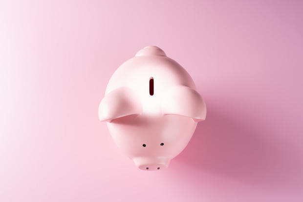 Spotlight Focused on the Coin Slot of a Piggy Bank 