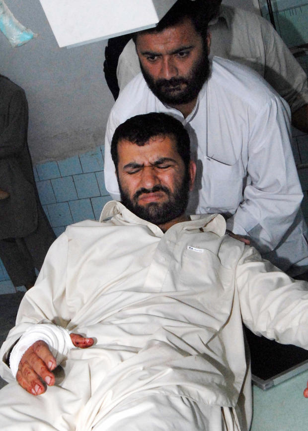 A relative helps injured Afghan journali 