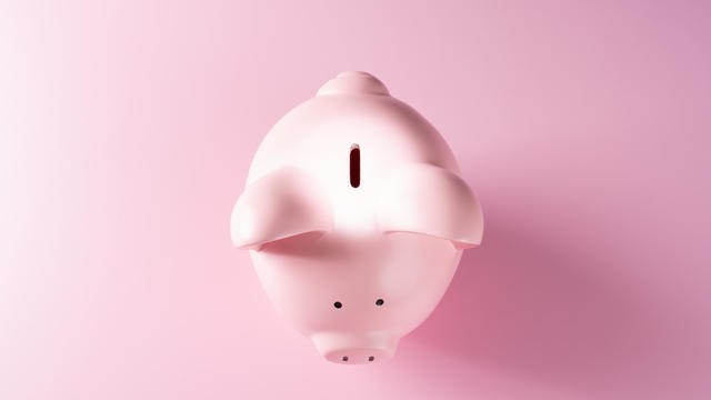 Spotlight Focused on the Coin Slot of a Piggy Bank 