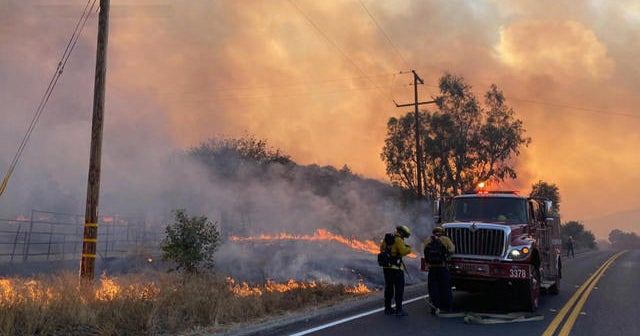 California wildfires force evacuations in heat wave - CBS News