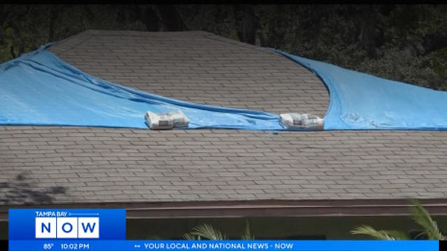 east-tampa-home-with-tarp-protecting-roof.jpg 